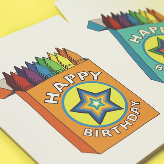 Happy Birthday card with multicolour crayons in orange box