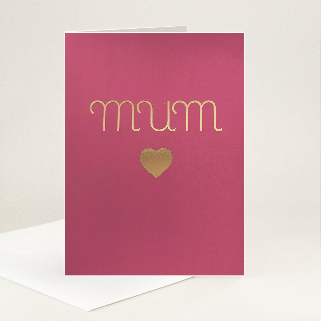 Elegantly lettered gold foil 'mum' with a heart underneath all on a raspberry background.