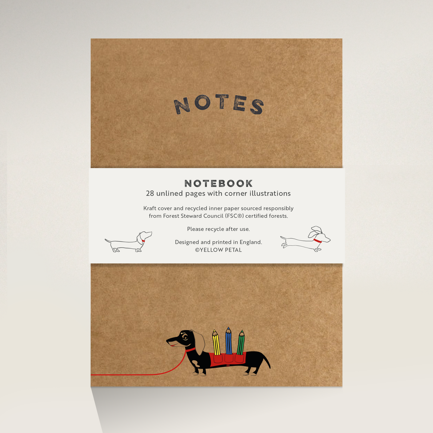 Brown Kraft notebook cover with illustration of Winston sausage dog carrying 3 pencils on his back with he words 'notes'.